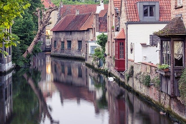 A canal with houses on both sides of it.