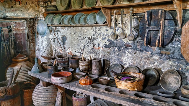 A kitchen with many pots and pans on the wall