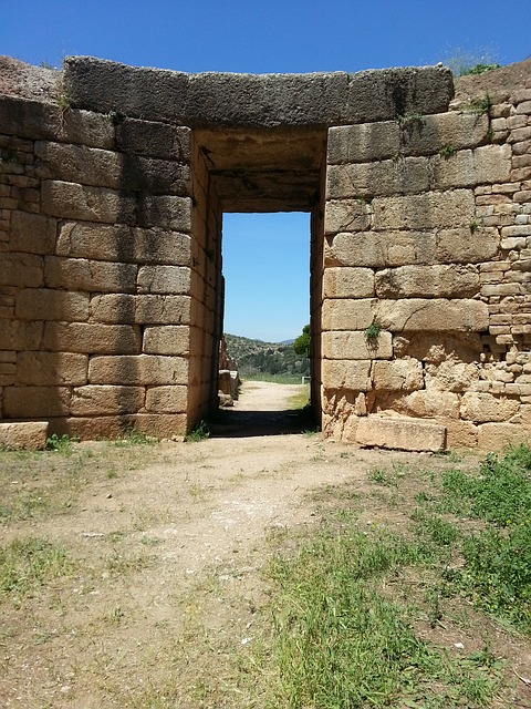 A door to an old stone building with a view of the desert.