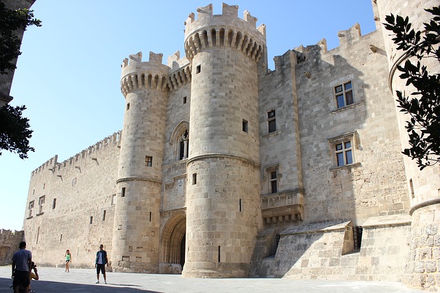 A person standing in front of a castle.