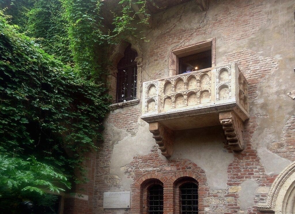 A balcony on the side of an old building.