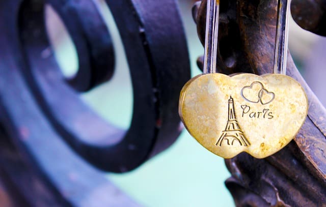 A heart shaped lock with the word paris written on it.