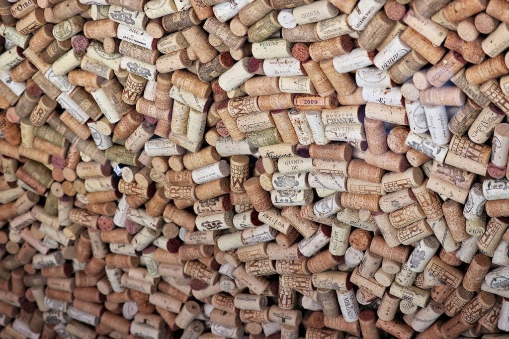 A wall of wine corks is shown in this image.