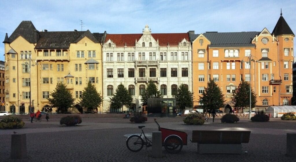 A bicycle parked in front of some buildings