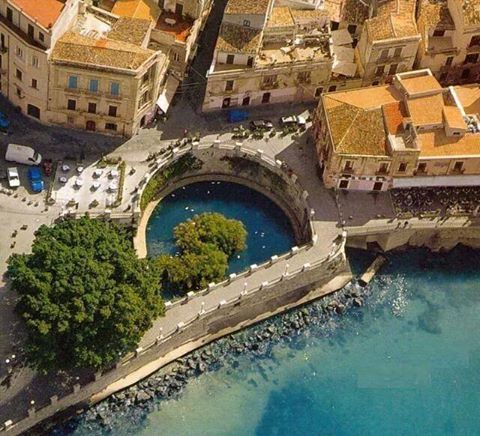 A bird 's eye view of an old town with water.