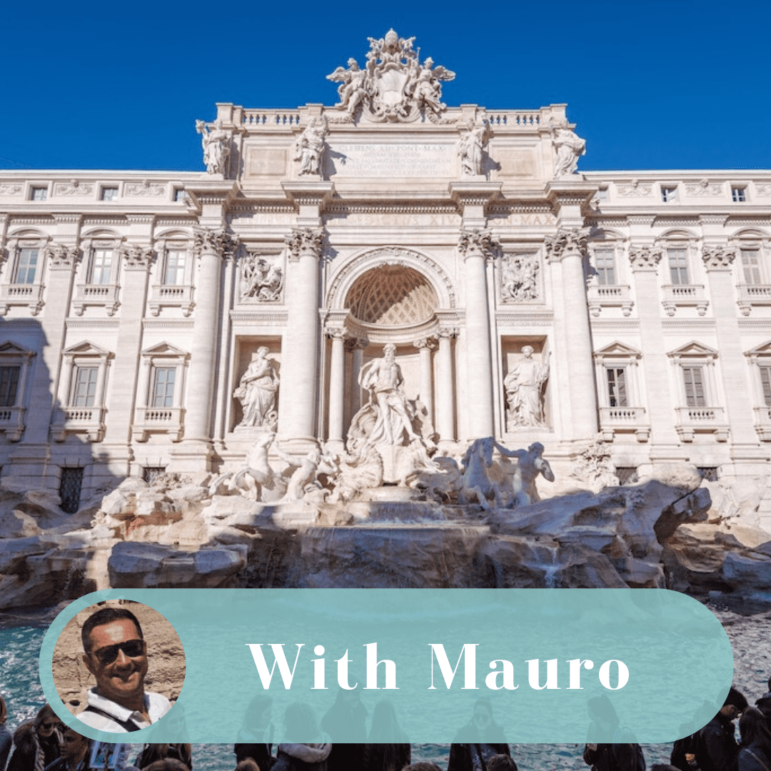 A picture of the trevi fountain with a man in front.