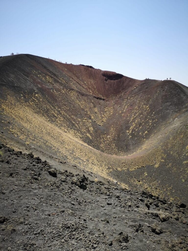 A mountain with brown and yellow colors on it