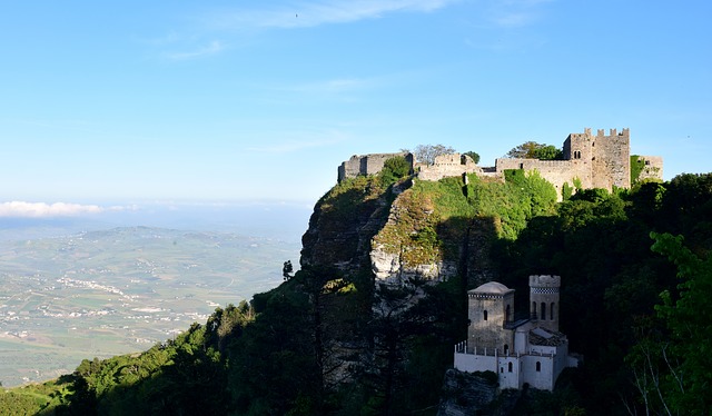 A view of the top of a mountain with a castle on it.