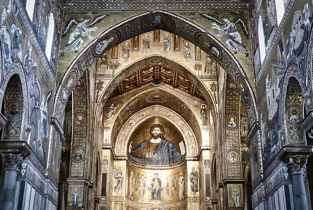 A large cathedral with many paintings on the walls.