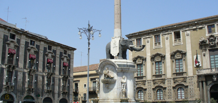 A statue of an elephant on top of a pillar.